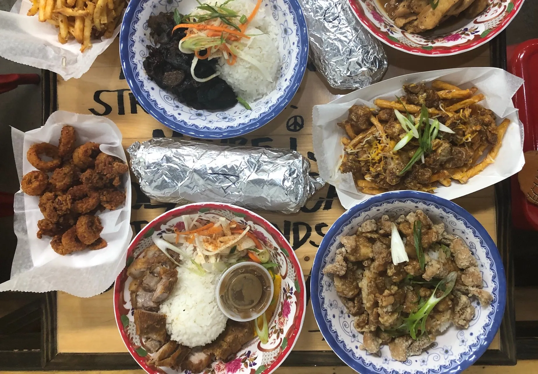 An overhead spread of Peace Love & Boba's Filipino dishes